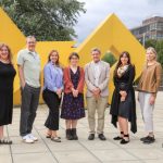 A picture of the STEMMA and Rare and Unique Projects team in front of the famous "Big Yellow Thing" at the University of Galway